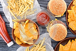 top view of assorted junk food on wooden